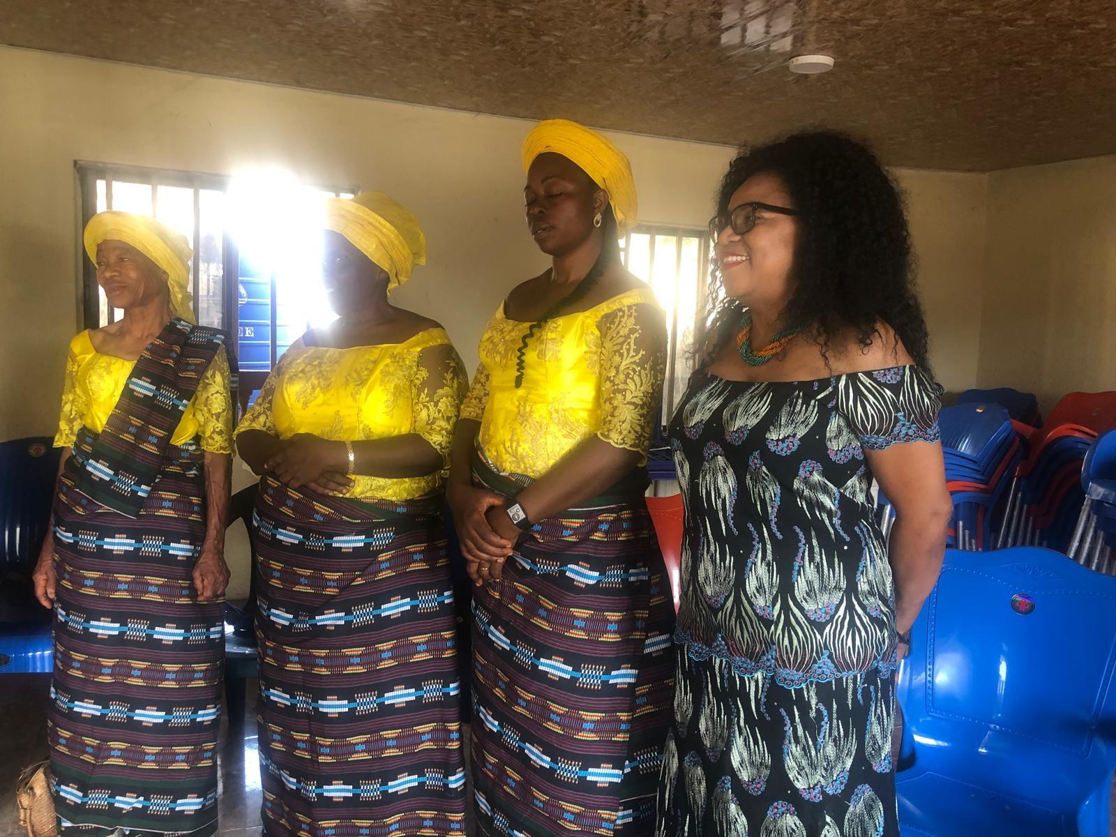 Community women singing together during an Adolice visit